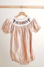 Load image into Gallery viewer, Khaki he is risen hand-smocked girl bubble - Abbies Place