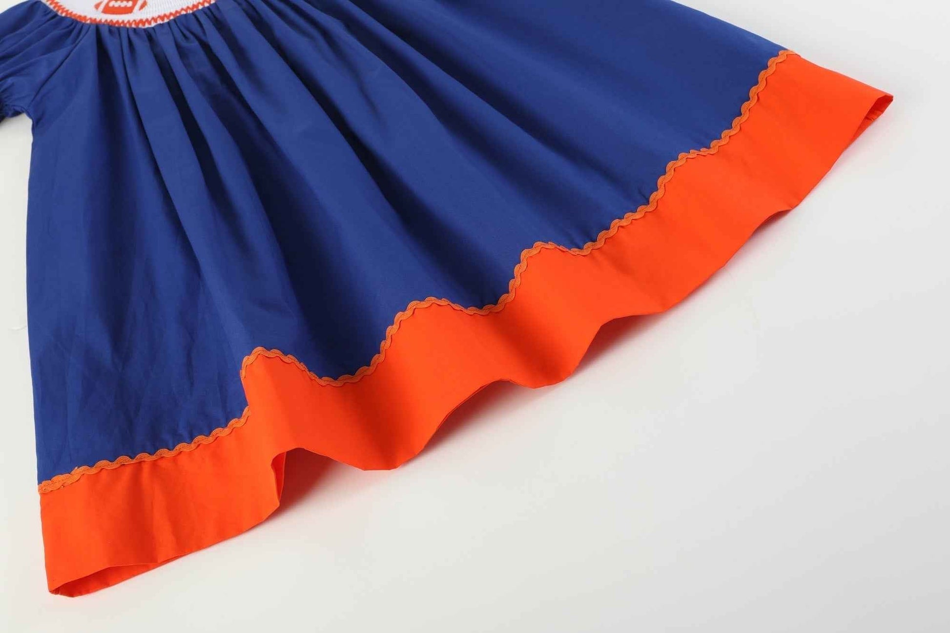 Blue and Orange Football Smocked Bishop Dress - Abbies Place