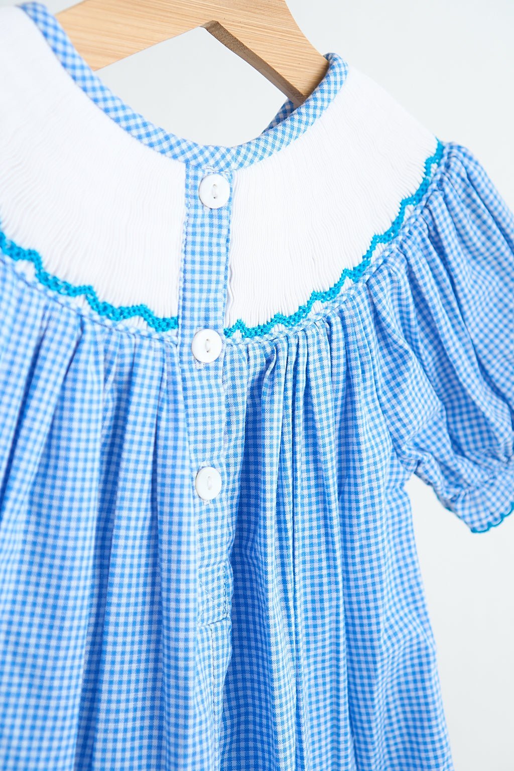 Blue snow princess hand smocked gingham girl romper - Abbies Place