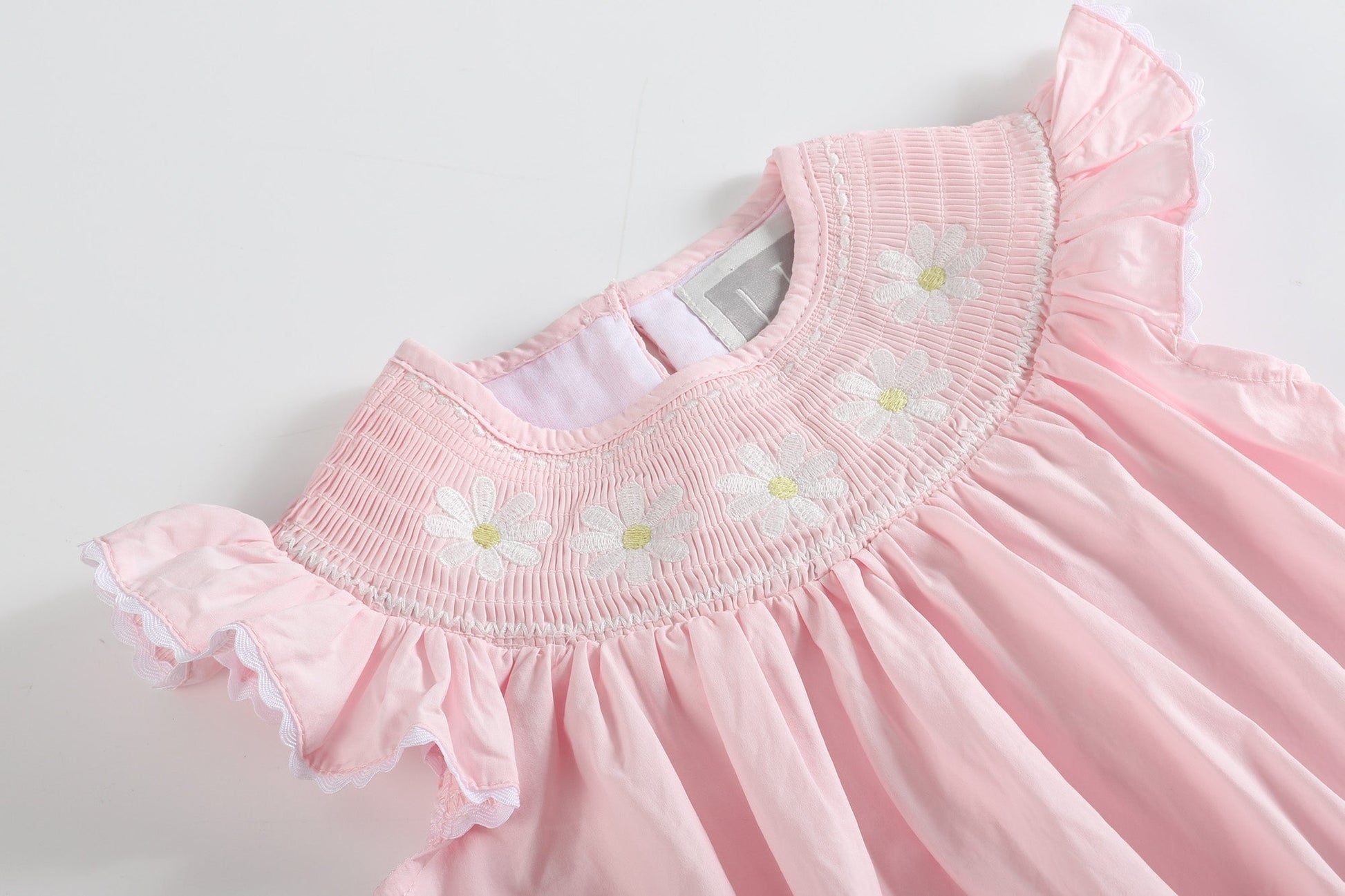 Light Pink Daisy Smocked Ruffle Romper - Abbies Place