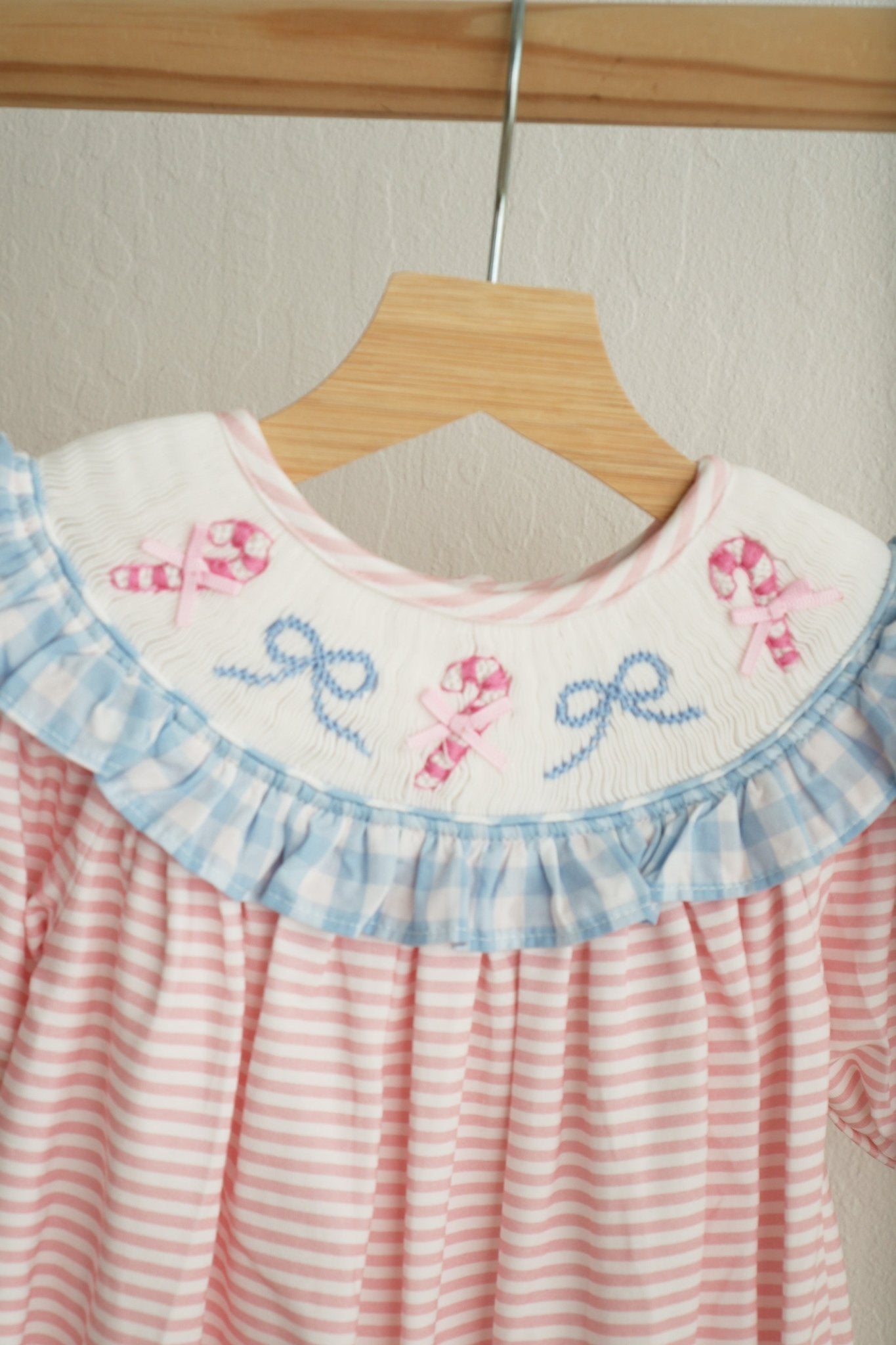 Pink candy cane bow hand smocked ruffle romper - Abbies Place