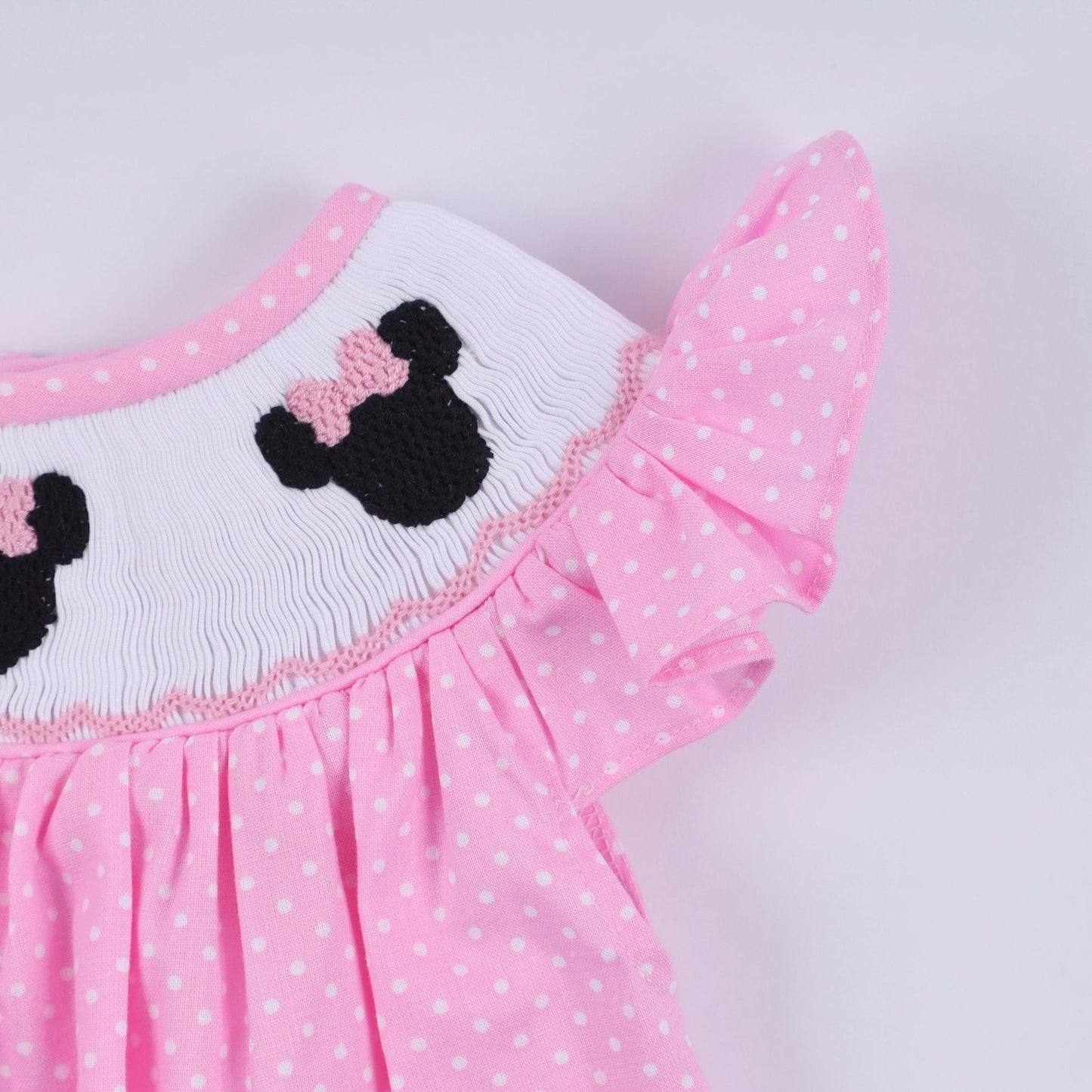 Pink character hand smocked dot ruffle bubble - Abbies Place